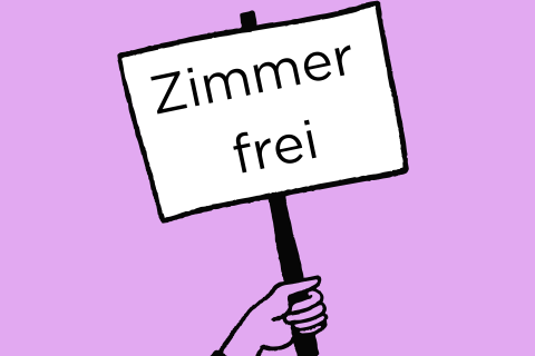 Eine Hand hält ein Schild mit der Aufschrift Zimmer frei